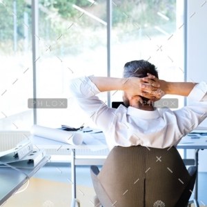 demo-attachment-112-Businessman-at-the-desk-in-his-office-resting.