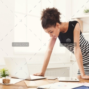 demo-attachment-115-business-woman-working-on-laptop-at-office-PRFJKQJ